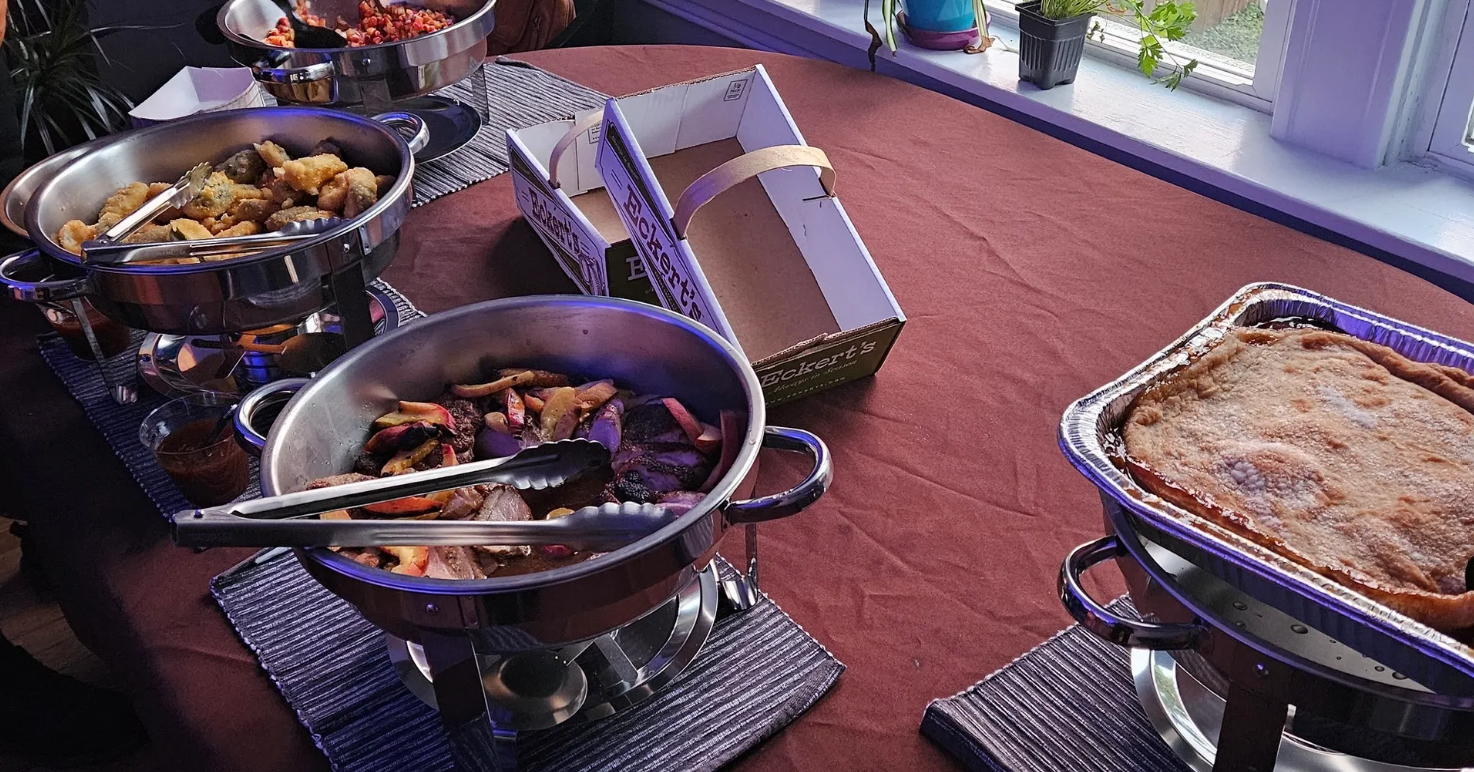 Full buffet spread set up at Eckert's — chafing dishes, linens, and Chef B's full catering service on display