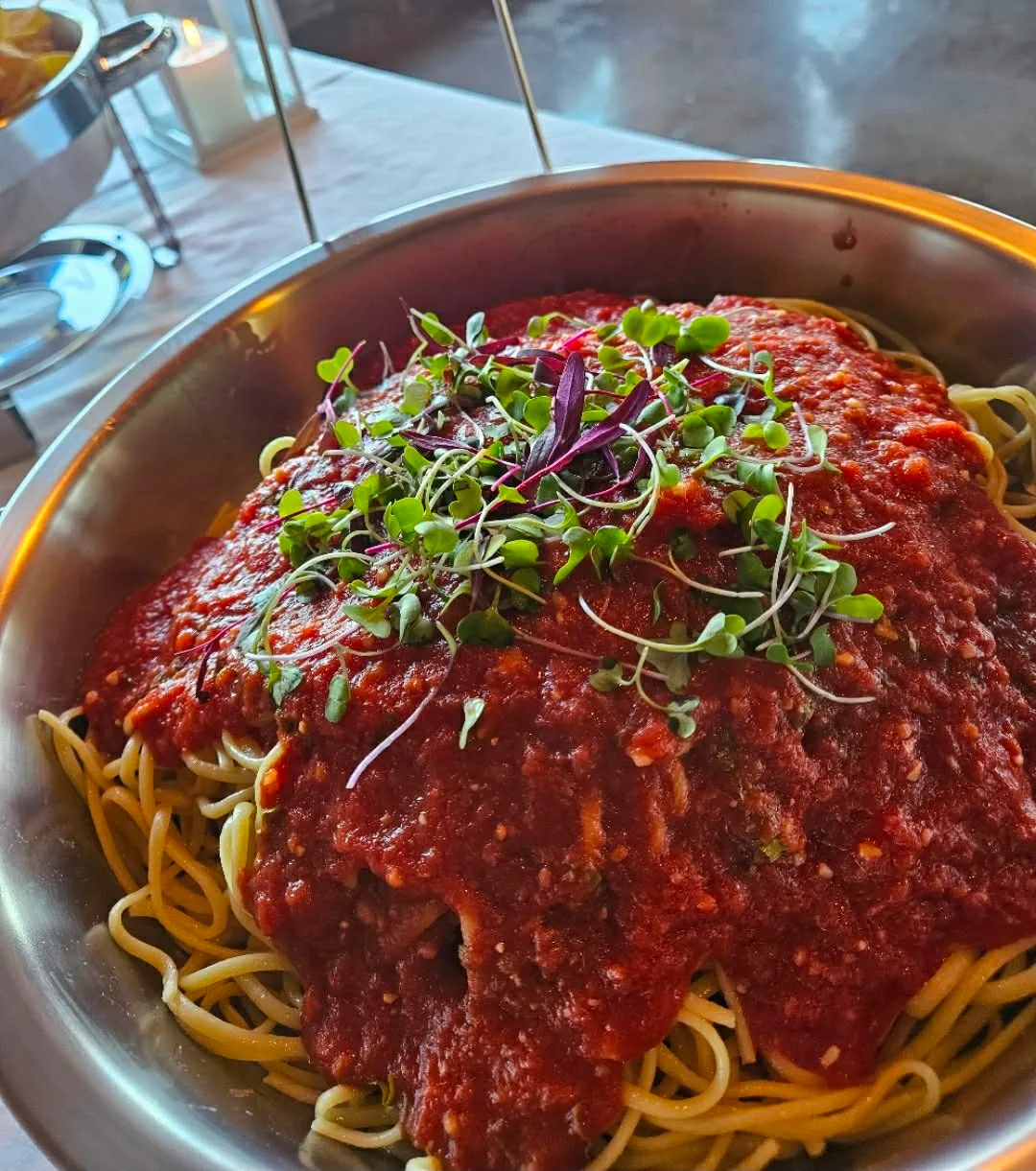 Spaghetti with house marinara and fresh microgreens by Chef B