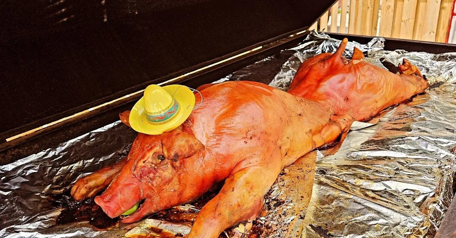 Whole-pig roast — Chef B's signature large-format event centerpiece